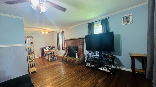 L-shaped living area with dining room | Image 7