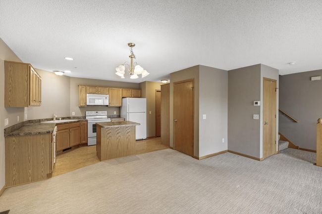 Open floor plan with a kitchen center-island. | Image 7