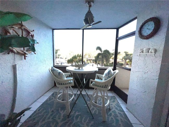 Balcony with view of pools and bay | Image 10
