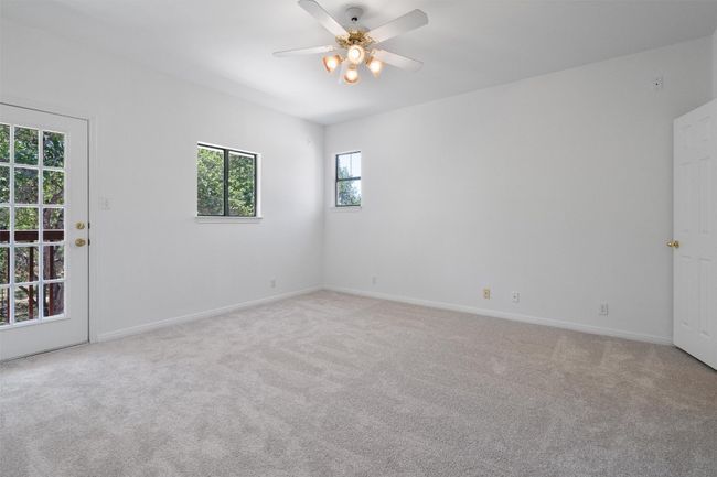 Spare room featuring ceiling fan, light carpet, and baseboards | Image 31