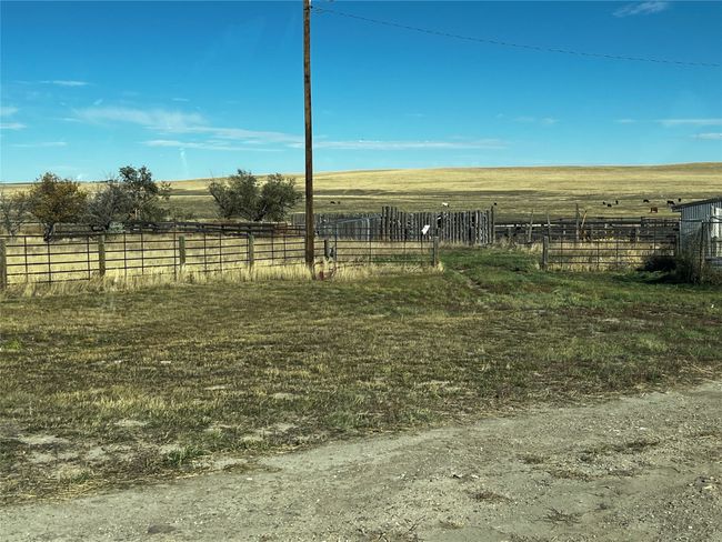 View of yard with a rural view and fence | Image 52