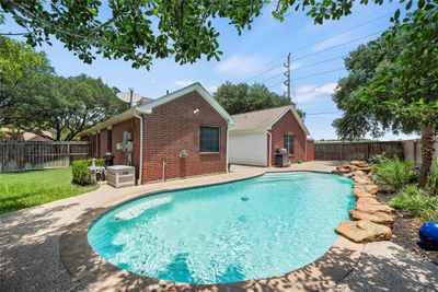 Spacious Backyard With Large Pool And Waterfall! | Image 3