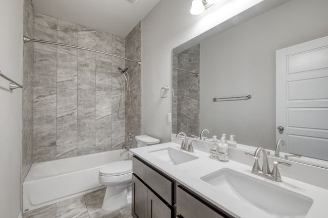 Full bath featuring shower / bathtub combination and double vanity | Image 27