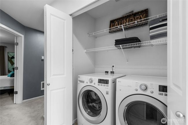 Full size washer and dryer conveniently located on the upper level near the bedrooms. | Image 17