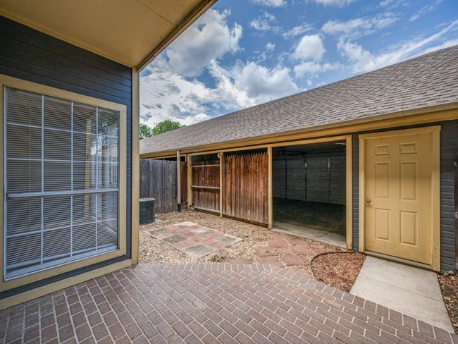 Patio with access to oversized two car garage with opener | Image 23