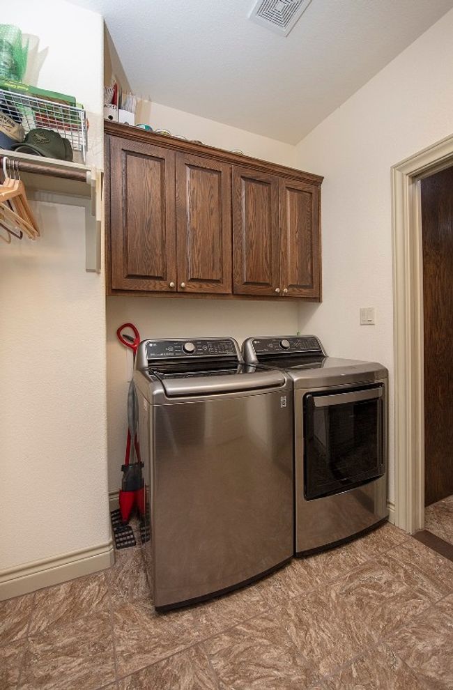 Washer/Dryer conveniently off of kitchen. | Image 14