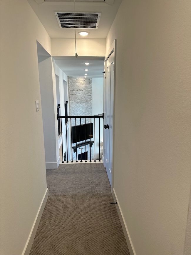 Hall with baseboards, visible vents, and carpet flooring | Image 37