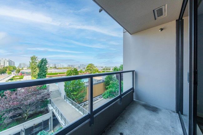 Balcony with a city view and visible vents | Image 20