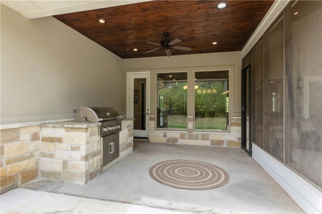 View of patio / terrace featuring an outdoor kitchen, a ceiling fan, and a grill | Image 30