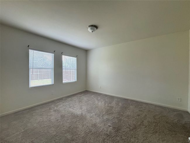 Carpeted spare room with baseboards | Image 11