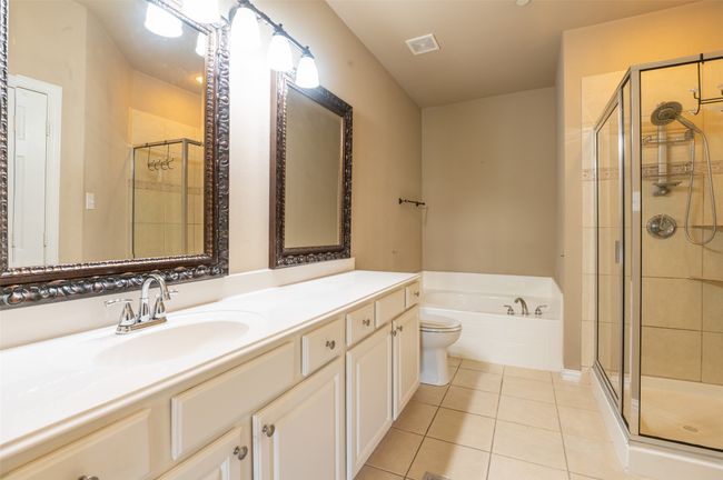 Ensuite primary bath with garden tub, separate shower, roomy linen closet. | Image 10
