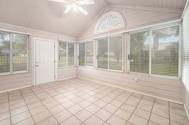 Sunroom is air conditioned. Lots of windows for natural lighting. Windows have solar screens. | Image 20