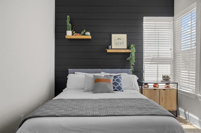 Carpeted bedroom featuring baseboards | Image 28