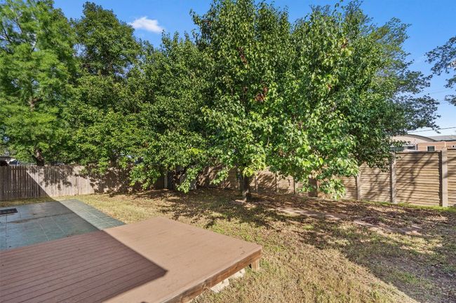 View of fenced backyard | Image 36