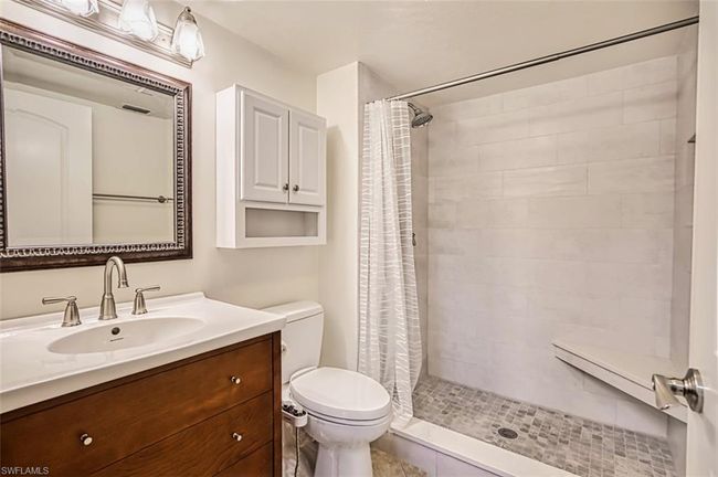Full bath with vanity, toilet, and tiled shower | Image 30