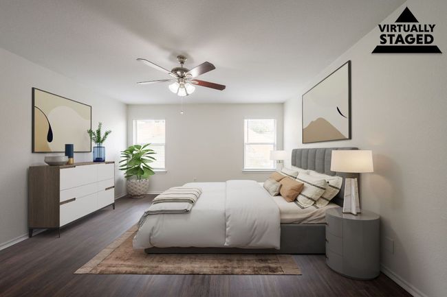 Bedroom featuring multiple windows, dark wood-style floors, ceiling fan, and baseboards | Image 15
