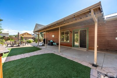 Exterior space featuring a patio area and a lawn | Image 2