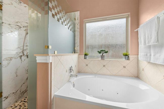 Dual vanity separate walk in shower and soaking tub. Large walk in closet. | Image 15