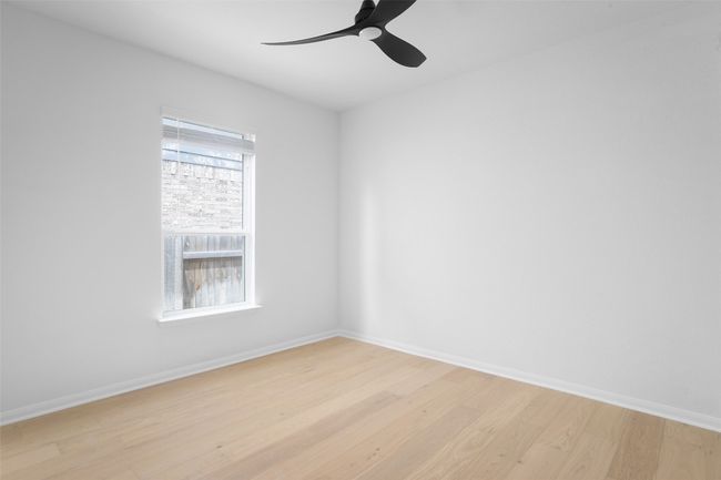 Light-filled secondary bedroom | Image 24