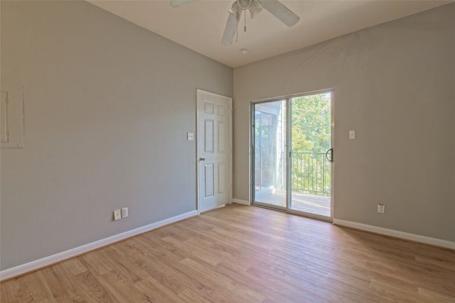 Unfurnished room with light wood-style floors and ceiling fan | Image 27