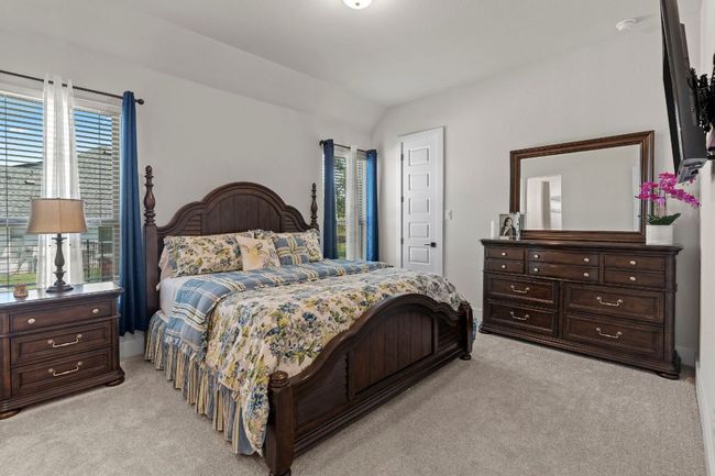 Bedroom with light carpet and vaulted ceiling | Image 19