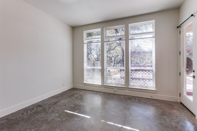 Unfurnished room featuring baseboards and concrete flooring | Image 14