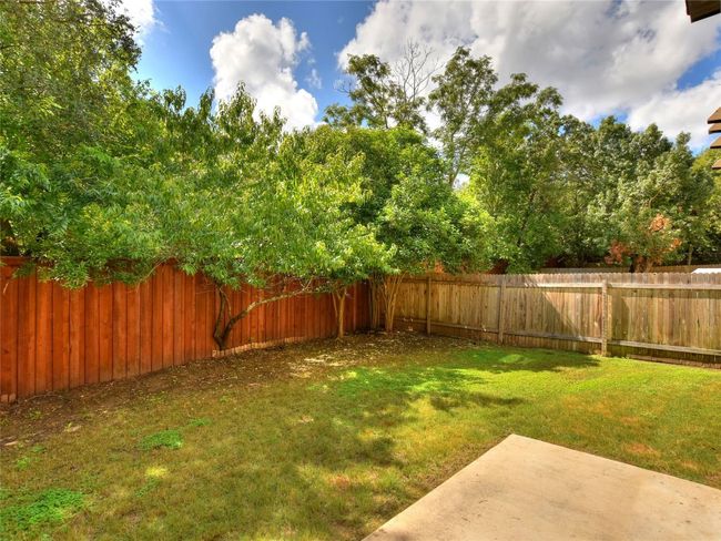 Fenced backyard and patio. | Image 23