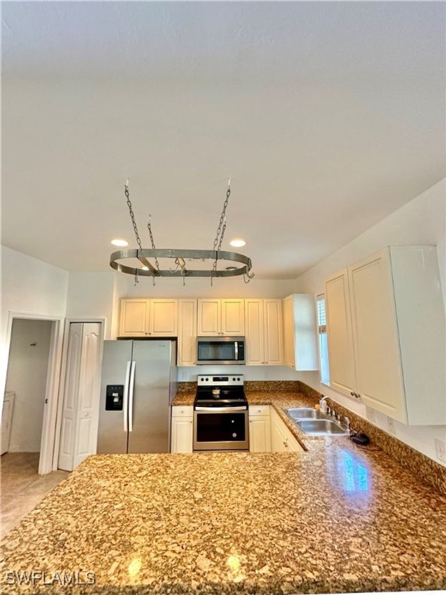 Kitchen with appliances with stainless steel finishes and sink | Image 9