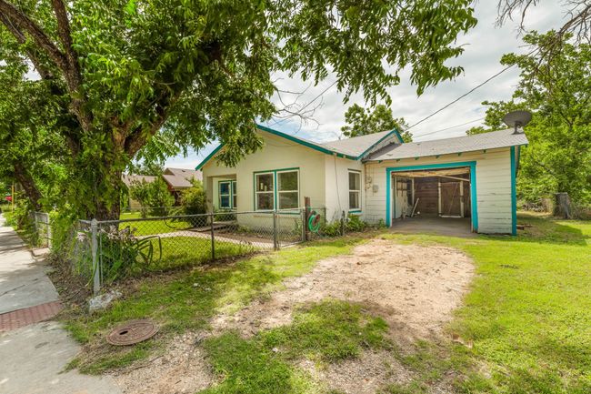 View of front of house featuring a garage and driveway | Image 4