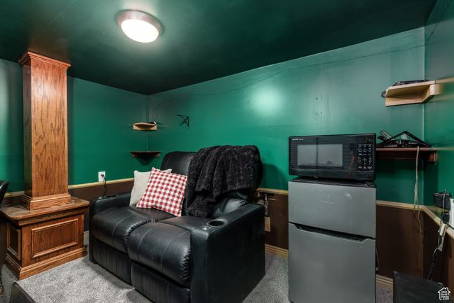 Home theater with carpet flooring and decorative columns | Image 24