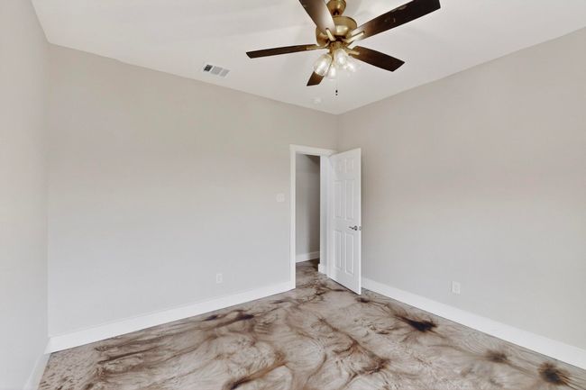 Empty room with ceiling fan and baseboards | Image 37
