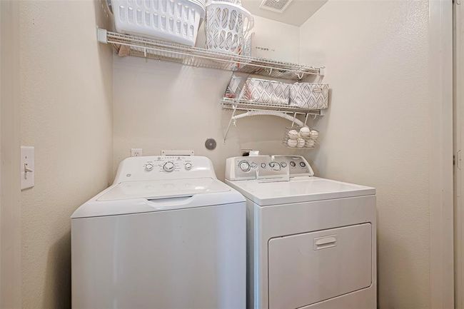 Washer/dryer is conveniently located on the upstairs landing between all the bedrooms. | Image 16