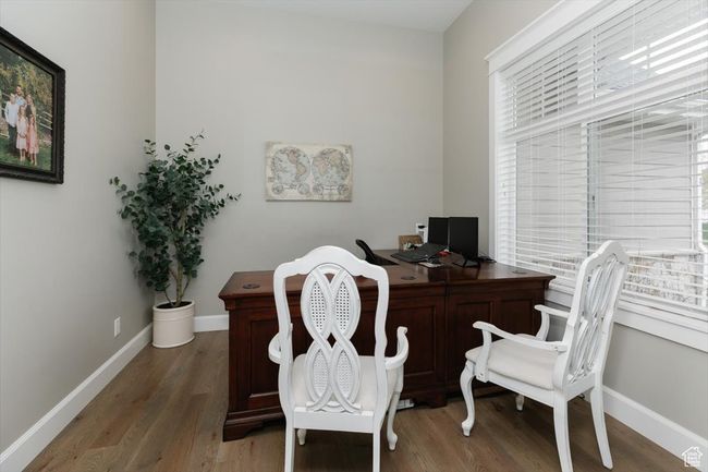 Office area with baseboards and light wood-type flooring | Image 25