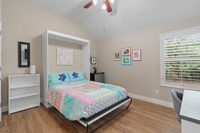 Bedroom featuring a murphy bed that will convey. | Image 22