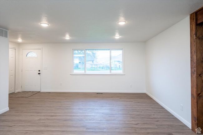 Foyer entrance with baseboards and light wood-type flooring | Image 7
