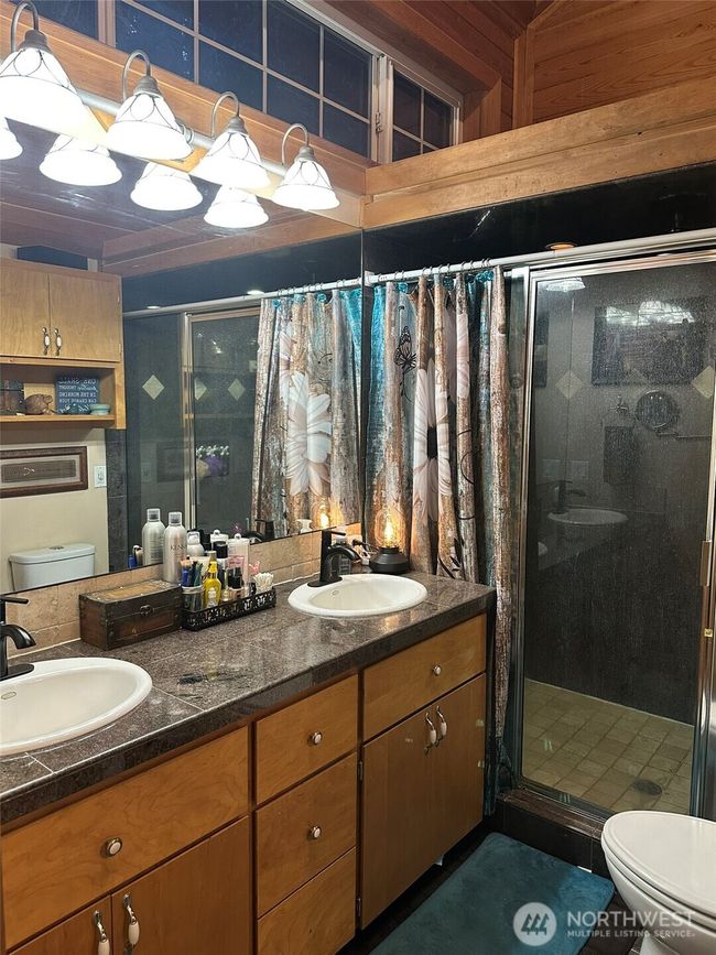 Master bathroom with huge, marble tiled shower, dual sinks & space above shower for plants or ??? | Image 18