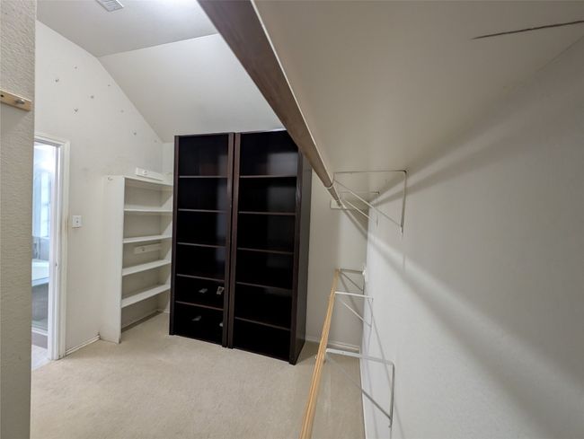 Spacious closet featuring lofted ceiling and carpet floors | Image 14