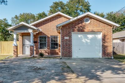 View of front of property with a garage | Image 1