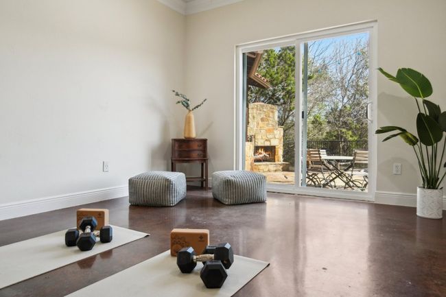 Sitting room featuring baseboards and finished concrete floors | Image 32