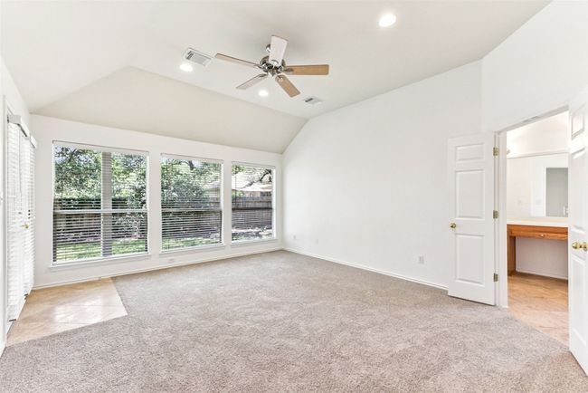 Large primary bedroom with fresh paint and newly installed carpet | Image 26