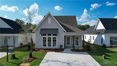 Designer Home on Lot 044! The Eli by Holland Homes LLC. All plans, pricing and specifications are subject to change without notice. | Image 2