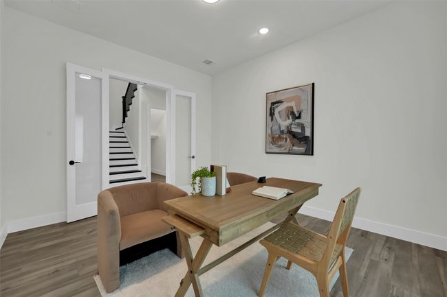 Office space featuring visible vents, wood finished floors, baseboards, and recessed lighting | Image 20