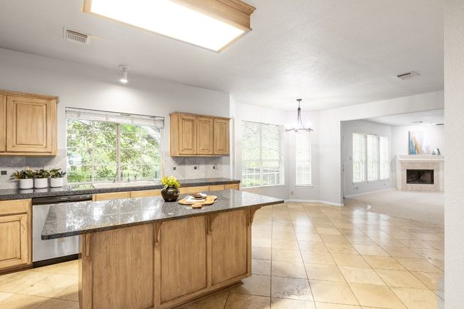 Kitchen with dishwasher, a sink, tasteful backsplash, and plenty of natural light | Image 15