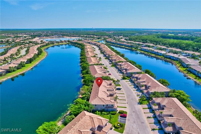 Aerial view of the coach homes at Jasmine point, showing the great number of lakes in the commnunity! | Image 5