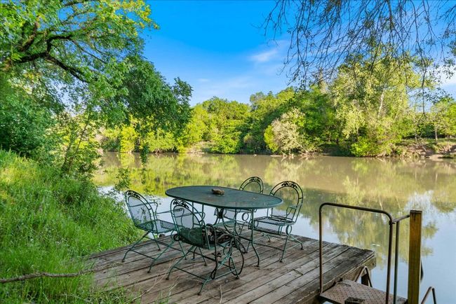 Dock area featuring a water view | Image 7