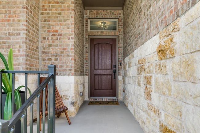 Property entrance with brick siding | Image 6