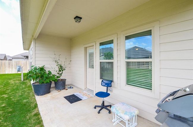 The covered patio is prepared to relax and refresh! | Image 27