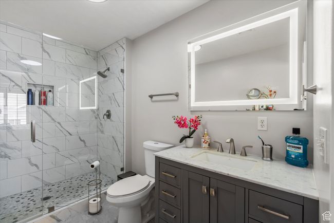 Full bath with toilet, a stall shower, and vanity | Image 18