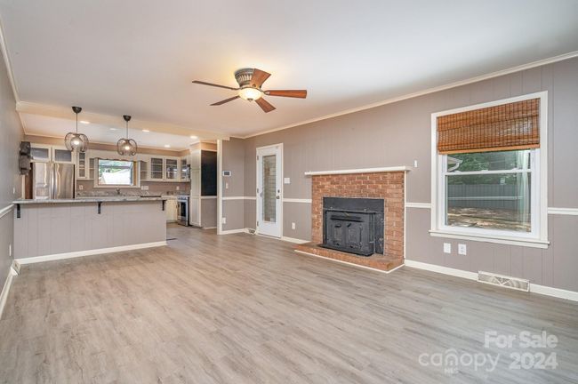 Family room onlooking kitchen | Image 12