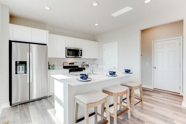 White cabinets make this kitchen bright, clean and crisp. Photo of model home, color & options will vary. | Image 4